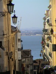 Central Lisbon.  The city is strikingly like San Francisco with the bay, steep hills, cable cars, and even a Golden Gate-looking bridge  (6/27/04)