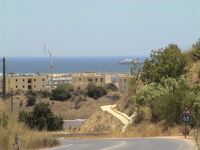 The approach to Lagos, Portugal - a Mediterranean resort town where I camped amongst the ants and dumpsters in a defiled campground.  This was a party town.  For those who were wondering, I failed to party.  (7/02/04)