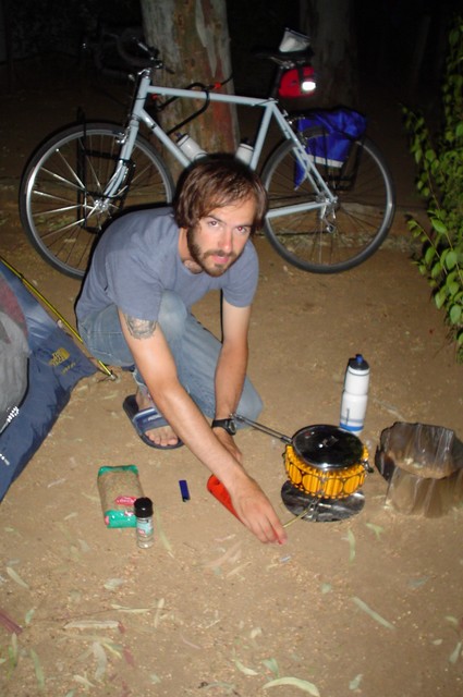 I am preparing my first camp-cooked meal in Cordoba on my stove that can burn any flammable substance known to humankind.  What the picture does not show is the giant fire-ball that subsequently came out of the burner, causing the French nearby to rush over.  I assured them that all was under control.  I since learned that my ignition technique was incorrect.  Pasta and tomato sauce was the menu of the evening.  I�m on the college diet again!  I saw a fantastic open-air concert that evening with a classical Spanish guitarrist and singer - a really memorable performance.  I was happy to be there.  (7/08/04)