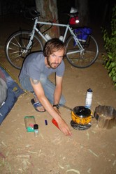 I am preparing my first camp-cooked meal in Cordoba on my stove that can burn any flammable substance known to humankind.  What the picture does not show is the giant fire-ball that subsequently came out of the burner, causing the French nearby to rush over.  I assured them that all was under control.  I since learned that my ignition technique was incorrect.  Pasta and tomato sauce was the menu of the evening.  I�m on the college diet again!  I saw a fantastic open-air concert that evening with a classical Spanish guitarrist and singer - a really memorable performance.  I was happy to be there.  (7/08/04)