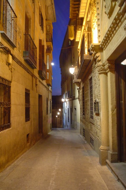 A deserted street in Toledo the evening of my arrival.  The city is set on a hilltop above the river, and was a welcome sight to see after several days of the countryside.  Toledo is the city of marzapan and swords - two items it will sell for all eternity.  That night a group of Scandanavians touring Europe on their Vespa scooters set up camp next to mine.  7/12/04)