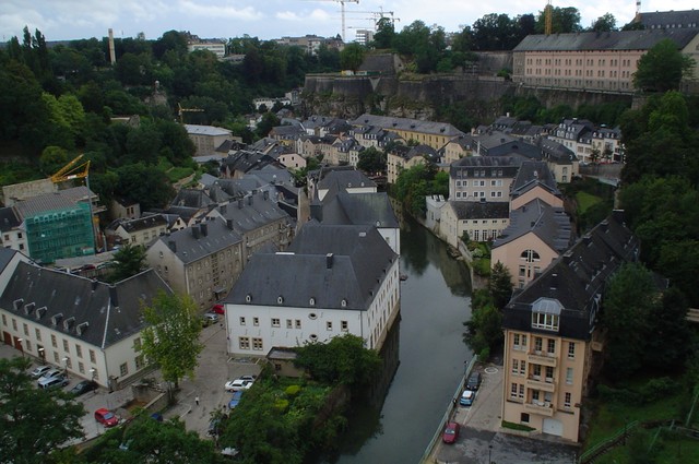 Luxembourg was cast in grey for the three days that I spent as a stranger in this strange land.  It is odd that this country is even permitted to exist at all in this day and age.  Luxembourg City, the capital, is the hypostasis of suburban perfection, perhaps because the sub-urban is never forced to confront the urban.  Imagine a village of plenty set in a stunning river gorge with rows of houses neatly maintained, sparkling Mercedes buses plying the streets, a benevolent scandal-free Prince Henri ruling the land, pastries for every man, woman and child, and everyone a perfect bilingual.  Although it is difficult to comprehend - or possibly even to imagine - I can now report that such a fantasyland truly exists secreted away between the borders of France and Germany.  (8/13/04)