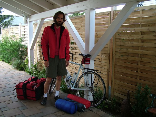 Leaving Marcus and Gabriele�s house after an extended stay, modelling some recently-acquired cold weather riding gear for my newly-planned northern route.  The morning of my departure I rolled out of the warmth of my soft feather bed, showered for the last time in the spotlessly clean light blue-tiled bathroom, ate a full breakfast (of sugar cereal with refrigerator-cold soymilk, and cinnamon bread with homemade jam), said goodbye to the faithful St. Bernard, and began cycling into the autumn chill in the direction of Belgium, psychologically prepared to resume the hardscrabble lifestyle of drifting from one European campground to the next.   8/31/04