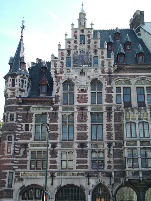The architechture in Brussels is very ornate, and there are several Royal Tennenbaum style structures in the city, an example of which can be seen above.  But I will digress for a moment to the topic of youth hostels.  I have avoided these institutions for most of my trip, and if camping is not available, I will generally try to find a cheap pension.  But Belgium is really expensive, so I decided to cut costs with a hostel.  The first night I was in a coed dormitory room with seven other people, and the non-ventilated air was sticky and filled with the sounds of rickety bunks creaking, snoring, and other anti-sleep-inducing noises.  As the moonlight at 3 o�clock in the morning hit the trees outside the window and cast swaying shadows on the ceiling above my bed, I said to myself, Michael, your too long in the tooth for this folly, old sport.  The courtyard always had a fop of a guitarrist playing tortured classics, such as "The End" (the Doors),  to a reluctant but captive audience.  (9/02/04)