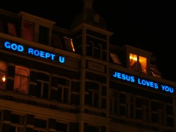 A helpful reminder to all of the visitors to the red light district in Amsterdam.  This building stood on the edge of the coffee-shop filled district.  (9/11/04)
