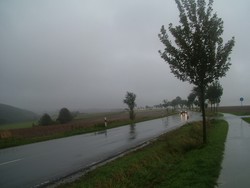 I started off from Paderborn to Kassel with near twilight conditions caused by storm clouds that were pouring down refrigerator-cold waters as I was breaking camp.  I slipped into cold and wet gear and headed for the highway with my breath forming clouds in the air.  It rained evil cold well into the afternoon, and as I cycled through towns of half-timber houses and cobblestone lanes, the conditions felt medieval in many respects.  But my fortunes were soon to change . . . (9/23/04)