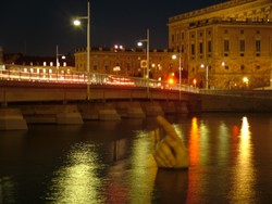 Oh yes, that way.  This giant hand breaking the water at night in one of Stockholm's rivers caused me to pause for a moment.  I looked in the direction it was indicating and saw a full moon - which if you are reading this today you should see later this evening as well.