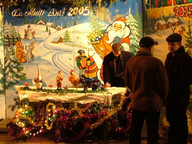 Like I said earlier, Christmas seemed pretty subdued.  There were, however, a lot of people out on the streets, and at the big park there were stands set up with Christmas scenes (like that here) where people were having their photographs taken.  There were also armies of those little plastic cars with motors that little Moldovan kids were using to ride all over the place - a special Christmas treat.  Incidentally, the language in the capital is Romanian, so I am back in non-cyrillic land again, as you can see in the display here.