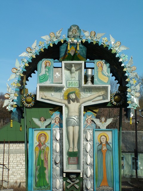 Even if the rural towns were a mass of concrete, if they were of any size at all they usually had a relatively impressive church, and if no church, then there were these decorated and partly-sheltered devotional stands.  So anyway, I cycled to the Romanian border the same day that I left Chisinau, and it was a completely uneventful crossing with the exception of accidentally overshooting Moldovan customs.  I got a visa-free, cost-free, interrogation-free entry stamp from smiling Romanian border gaurds who wished me a pleasant "bon voyage."  (1-9-05)