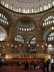 The interior of the Selimiye Camii is just as astounding as the exterior.  After some mosque viewing I got something to eat because the previous day's diet had consisted only of candy bars and the last of my smoked-tofu liverwurst substitute - and it was so delicious - Pide, salad, lentil soup, and some sort of coconut and cheese dessert (it was good, really). Turkey = Yummy.  (1-22-05)