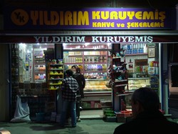 A local market in Edirne, Turkey.  I got enough Baklava to make a person sick, but I made it through anyway.  (1-22-05)