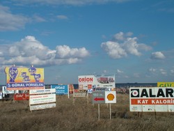 Turkish Thrace seems more Western to me than the last seven countries that I have ridden through - and there is definitely more Western investment.    Also the road quality and signage is way better.  This collection of billboards was on the D-100 from Edirne to �horlu on a warm sunny day of riding. Riding on the bike through Turkey has been great so far - you get lots of honks and waves from friendly Turkish drivers.  In �horlu the talkative hotel owner sat down to breakfast with me - we could make ourselves mutually understood in German (he had lived in Switzerland for 15 years).  He told me about a 50 year old German priest who had passed through months ago on a bike who had come from Germany - the town is right on the overland route, so I am sure it sees its share of cyclists.  (1-23-05)
