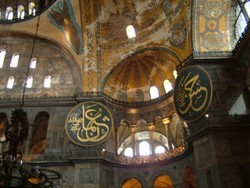 The Hagia Sophia (or Aya Sofya, or Sancta Sophia, or the Church of Divine Wisdom) is the flaking paint old fogey of Sultanahmet, the one who could tell a story or two about 15 centuries of New Rome (or Constantinople, or Istanbul).  I used to hate the Byzantine Empire, finding it a bit traitorous and, well . . . Byzantine.  How stupid is that?  Anyway, I am starting to really dig Byzantine art.  The reality of the Hagia Sophia, however, did not quite live up to my preconceived notions of its grandeur.  It seemed a little junked from its several transformations of character, from its original and intended incarnation as Emporer Justinian's cathedral, to Mehmet the Conqueror's hasty conversion to a mosque, to its present form as a national museum under Attaturk's secularizing policies of the 30's.  Lest any of you gentle readers think that I harbor any bias against the Ottoman conquerors, you should know that I had the same reaction when I visited the Mezquita in Cordoba Spain, which was one of the finest mosques in Muslim Spain - until the Catholic Reconquista of the Iberian peninsula.  After recapturing Spain, the church authorities turned the Mezquita mosque into a cathedral - thereby turning something uniquely beautiful in the world into something considerably less so.  The converted use always seems so snap on and disruptive.  But anyway, the Hagia Sophia was under a mess of scaffolding while I was there, which probably contributed to my reaction.  (1-25-05)