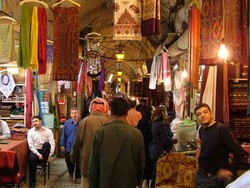 The Aleppo Souq was without the soft and hard sell hassle of some other bazaars and souqs, and I was pretty much left to myself as I wandered around the maze of covered passages full of shops. There is a certain order to the chaos in that the souq is divided into different areas for different goods, such as spices, cloth, hardware and various other items.  I accidentally wandered into the meat section and it was like entering the fifth circle of hell with lamb carcasses hanging from hooks, boiled lamb heads piled on racks and intestines bubbling in buckets over bloody gutters.  It was definitely not a walk along the meat counters at home where you are shielded from the butchery.  Switching gears for a moment, I cannot believe how cheap everything is here. For example,  I handed over two 50 pound notes (less than 2 dollars) at the souq and indicated I wanted as much hummus as that would buy.  After the vendor handed me a heaping plastic sack stuffed with a half-kilo of the beige goop and told me that covered the first 50 pound note, I opted to take the other back.  A clean hotel room is five dollars, a felafel sandwich is a little over 20 cents - it would be a good place for a starving artist to set up shop.   (3/19/05)