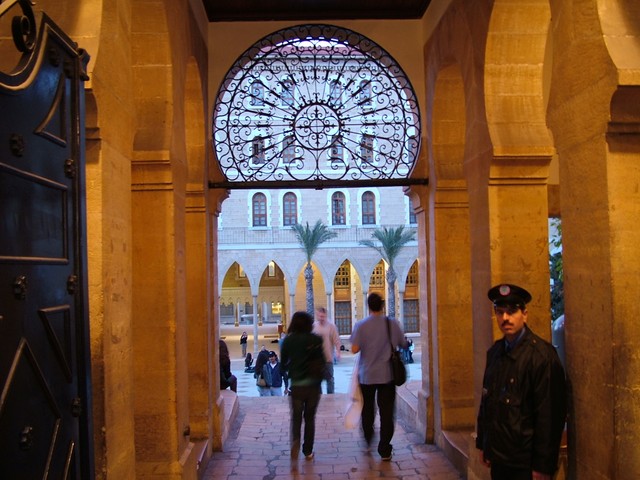 Beirut is a university town, and houses the American University of Beirut - what the trusty book refers to as the most prestigious university in the Middle East.  The area around the university is a bizarre mixture of university town fixtures and Rodeo Drive accessories.  There are the low key eateries, but they seem populated by students driving up in luxury automobiles and designer clothes.  This is another part of town where you have to remind yourself that you are in Lebanon, because English seems to be spoken more than Arabic (all instruction at the university is in English).  I wanted to tour the campus, but that is for i.d. holders only.  This stern security guard kindly let me take a picture of the hallowed entrance gate, but responsibly denied me further access.  (3/30/05)