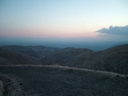 This was toward the end of the ride up to the top of Nemrut Dagi, with a summit of 2150 meters - or 7052 feet.  The hierothesium of Antiochus I Epiphanes at the top of the summit was a wierd scattering of heads fallen from the seated statutes, and that - as well as the views from the top - were worth the struggle to the top.  But I made a few bad choices here that had some nasty results, and were you there with me at two o'clock in the morning you unfortunately would have seen me: (1)sick as a food-poisoned-dog underneath body-odor sheets that smelled as if they had not been washed since Antiochos ordered the construction of the hierothesium, (2) in a bunk room sleeping with a snoring father-and-son duo who manned the summit station and who earlier had supplied the food my stomach would later forcefully and painfully reject, (3) regretting every breath in the bunk room filled with noxious smoke from an unsealed wood stove that the duo had fed a constant supply of plastic-coated cardboard for fuel, (4) wishing I could not hear the ceasless pecking - like a constant request for release - of a poor little bird trapped in an evil small cage of sticks underneath one of the bunks (which later caused a moral dilemma in the morning as to whether its conditions of captivity were so appalling that I would be culpable for failing to secure its release), and (5) making repeated runs of desperate haste outside the room to the stenchified bathroom block in the pitch darkness with cold summit night winds blowing to puke up the entire contents of my stomach.  It was the kind of night where I thought seriously about getting a return ticket home.  I guess my stomach is not as strong as I thought it was with foreign food.  (4/15/05)    