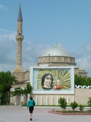 People talk about Turkey being a liberal secular state, but I thought that Azerbaijan was far more liberal, and had a more secular feel to it, particularly in terms of the professional and social freedom accorded women - absolutely no burqas, plenty of women in the workplace and a sense of social integration that you would not find in more religiously conservative/fundamentalist countries.  Obviously I am writing this from a western perspective.  During the Soviet era many of the mosques were destroyed, so many of the mosques that I would come across were fairly new, such as this one in Yevlax, with the Soviet style relief in front.  (5-18-05)