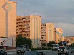 Aktau is a city dedicated to resource extraction, surrounded by nothingness so vast that all of the city�s water comes from a nuclear-powered desalinization plant.  I could see evidence of Shell, Texaco, and other western oil companies that had set up shop here, and sitting in the downtown Shamrock restaurant did not feel all that different from the Fisherman�s Wharf in Baku.  The same expatriate oil workers eating western food, speaking in southern accents, listening to Madonna and Elton John and discussing the business of oil were all here as well.  The town itself had a definite Soviet feel to it, with row after row of dormitory-style buildings, WWII memorials, and broad socialist avenues.  (6-02-05)